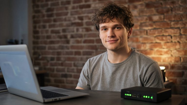Someone comparing hosting providers on a laptop